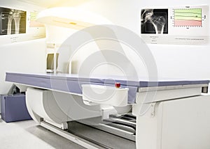 Bone density machine, is in the Xray department of hospital used for diagnose osteoporosis symptoms photo