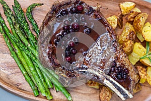 Bone in ribeye with a fresh huckleberry port reduction