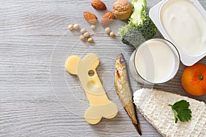 Bone shaped cheese and bone strengthening foods products, concept osteoporosis and prevention photo