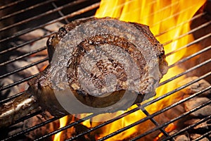 Bone-in Tomahawk Ribeye Steak on grill angled