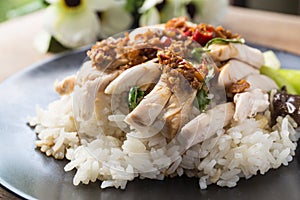 Boned, sliced Hainan-style chicken with marinated rice photo