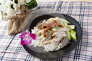 Boned, sliced Hainan-style chicken with marinated rice photo