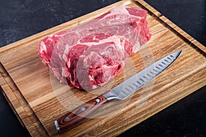 Boneless Beef Chuck Roast with a knife