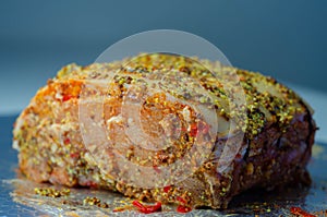 Boneless British rind-on pork loin joint, prepared in marinades, crackling joint
