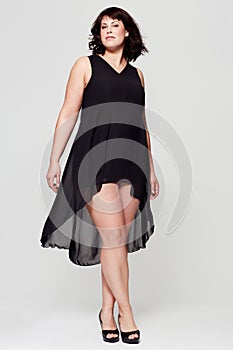 Bones are for dogs. Full length studio shot of young woman wearing an elegant evening dress.
