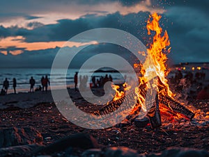 A bonfire blazes the heart of the beachs summer night festivities