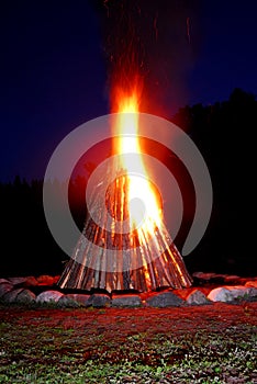 Bonfire blazing in the night photo