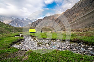 Bonfire and Camping Tent in Chitkul Trek - Landscape of Sangla Valley, Himachal Pradesh, India / Kinnaur Valley