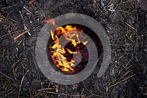 Bonfire in the earth - Dakota fire hole for survival in the wild