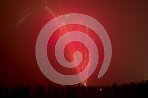 Bonfire night people watching fireworks.