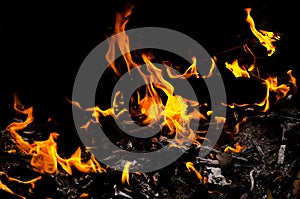 Bonfire with orange flames dark night in a under a blurred background, Flame, heat fire abstract background black background