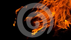 Bonfire with orange flames dark night in a under a blurred background, Flame, heat fire abstract background black background