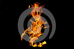Bonfire with orange flames dark night in a under a blurred background, Flame, heat fire abstract background black background
