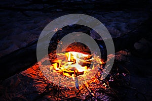 Bonfire in a summer night, burning log