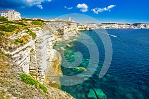 Bonifacio town on beautiful white rock cliff with sea bay, Corsica, France, Europe.