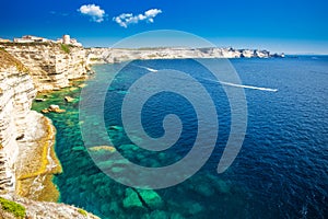 Bonifacio town on beautiful white rock cliff with sea bay, Corsica, France, Europe.