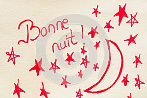 Bonne nuit good night handwriting text close up isolated on yellow paper with copy space photo