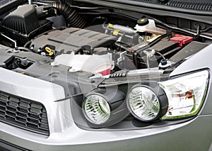 Bonnet and engine, storage battery of a car