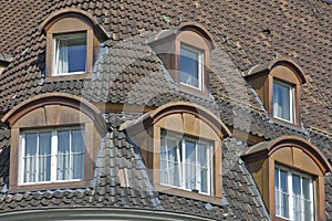 Bonneted dormer windows and tiled roof