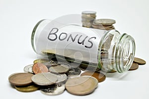 Bonus lable in a glass jar with coins spilling out