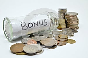 Bonus lable in a glass jar with coins spilling out