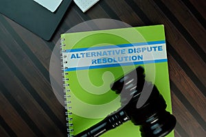 The book of Alternative Dispute Resolution isolated on Wooden Table. Law concept