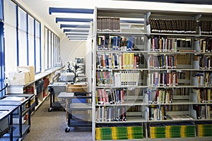 Book Arranged On Shelves In High School Library