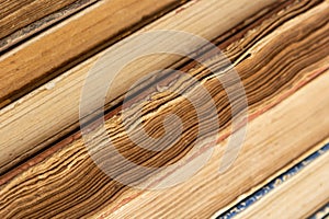 Book background. Stack of books in the library. Old yellow pages of paper books. Learning and knowledge