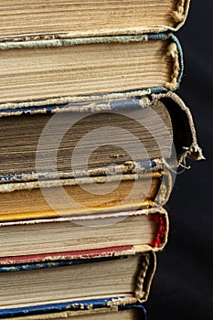 Book background. Stack of books in the library. Old yellow pages of paper books. Learning and knowledge
