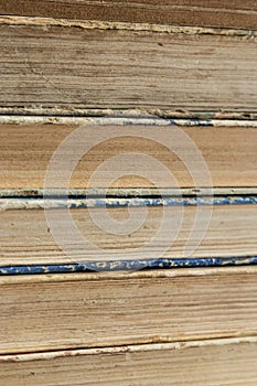 Book background. Stack of books in the library. Old yellow pages of paper books. Learning and knowledge