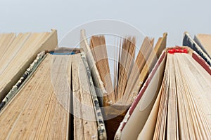 Book background. Stack of books in the library. Old yellow pages of paper books. Learning and knowledge