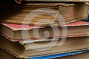 Book background. Stack of books in the library. Old yellow pages of paper books. Learning and knowledge