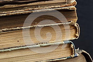 Book background. Stack of books in the library. Old yellow pages of paper books. Learning and knowledge