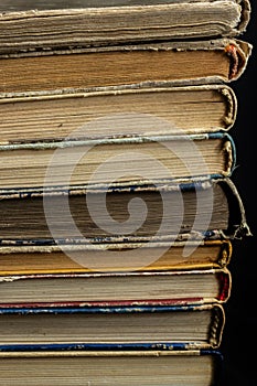 Book background. Stack of books in the library. Old yellow pages of paper books. Learning and knowledge