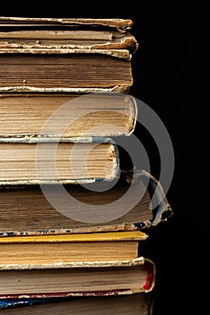 Book background. Stack of books in the library. Old yellow pages of paper books. Learning and knowledge