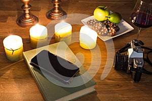 A book and burning candles