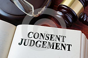 Consent judgement and a gavel. photo