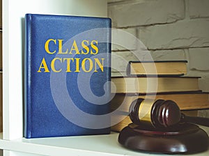 Book about class action lawsuit on shelf.