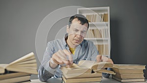 Book close-up flipping pages. Man reading a book in the library close-up. Education bookstore exam concept. University