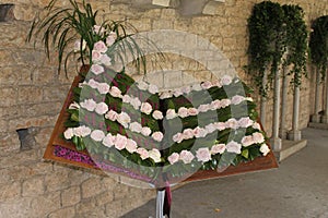 Book decorated with roses with the text of a Gregorian chant of hallelujah photo