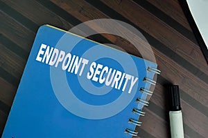 The book of Endpoint Security isolated on Wooden Table