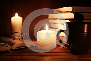 Book glasses candle night