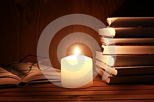 Book glasses candle night