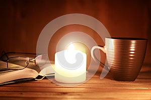 Book glasses candle night