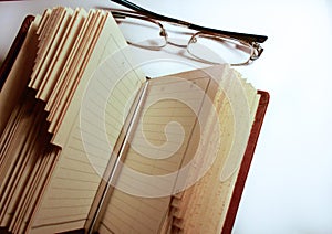 book glasses and pen