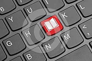 Book icon on laptop keyboard