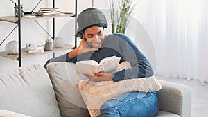 Book leisure smiling woman reading couch home