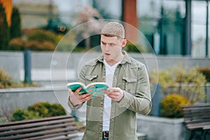 Book Lover's Dream A Man Overwhelmed by His Latest Read in Nature