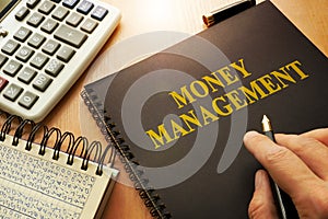 Book with money management.