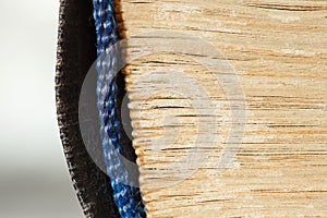 Book old, side is folded sheets, binding is rag close-up macro view